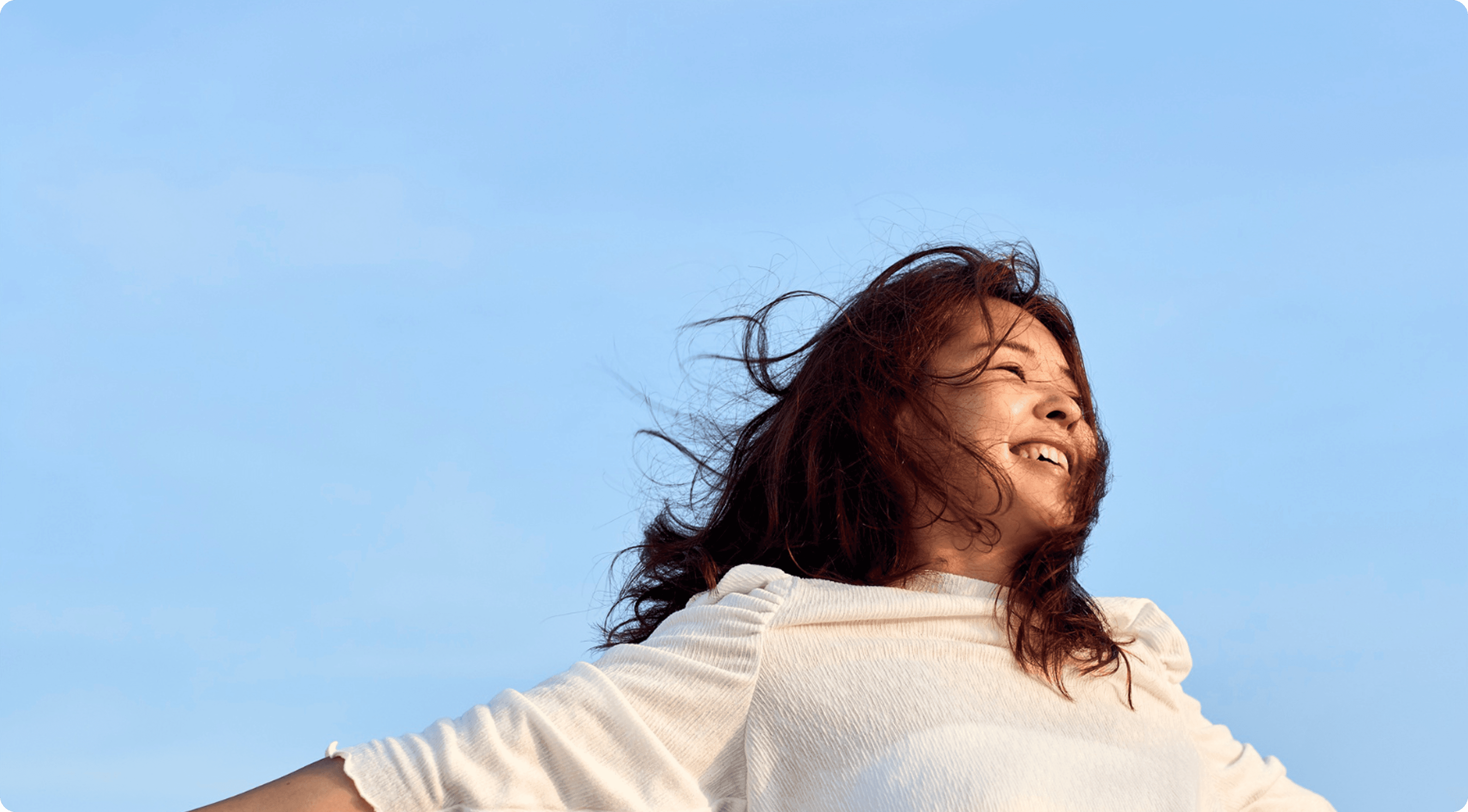 A happy woman after being scored via Noggin